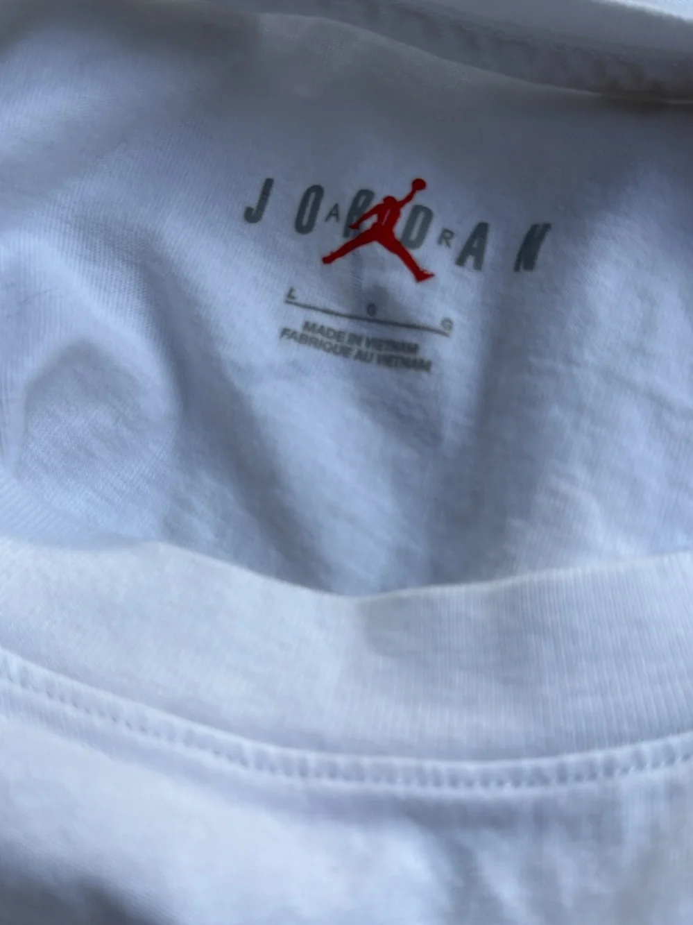 Jordan White Graphic Basketball Tee with Red & Black Accents